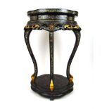 A 20th century Chinese black lacquered stand/occasional table, the shaped top with landscape scene