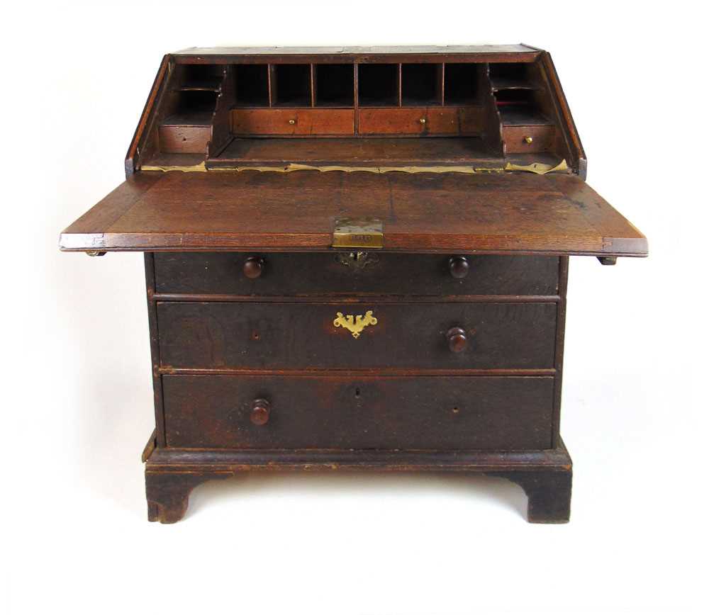 A late 17th/early 18th century oak bureau, the veneered fall front enclosing a fitted interior - Image 2 of 2