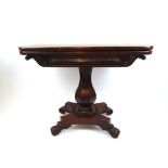 A William IV mahogany tea table, the fold over top supported on a swivel action over the octagonal
