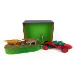 An automaton of dogs gnawing on a bone, sandbox gymnast by Novelty Krafts and a wooden car driven by