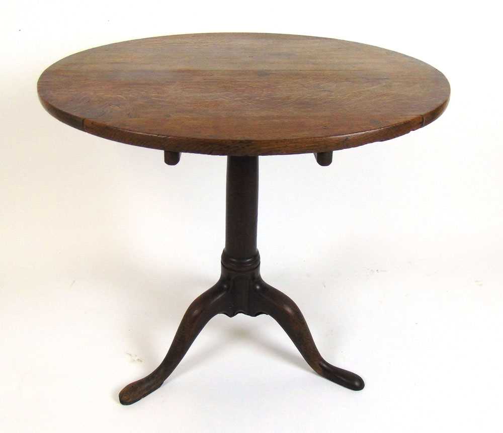 An 18th century oak tilt top tripod table, the circular top on a turned column on three splay - Image 2 of 11