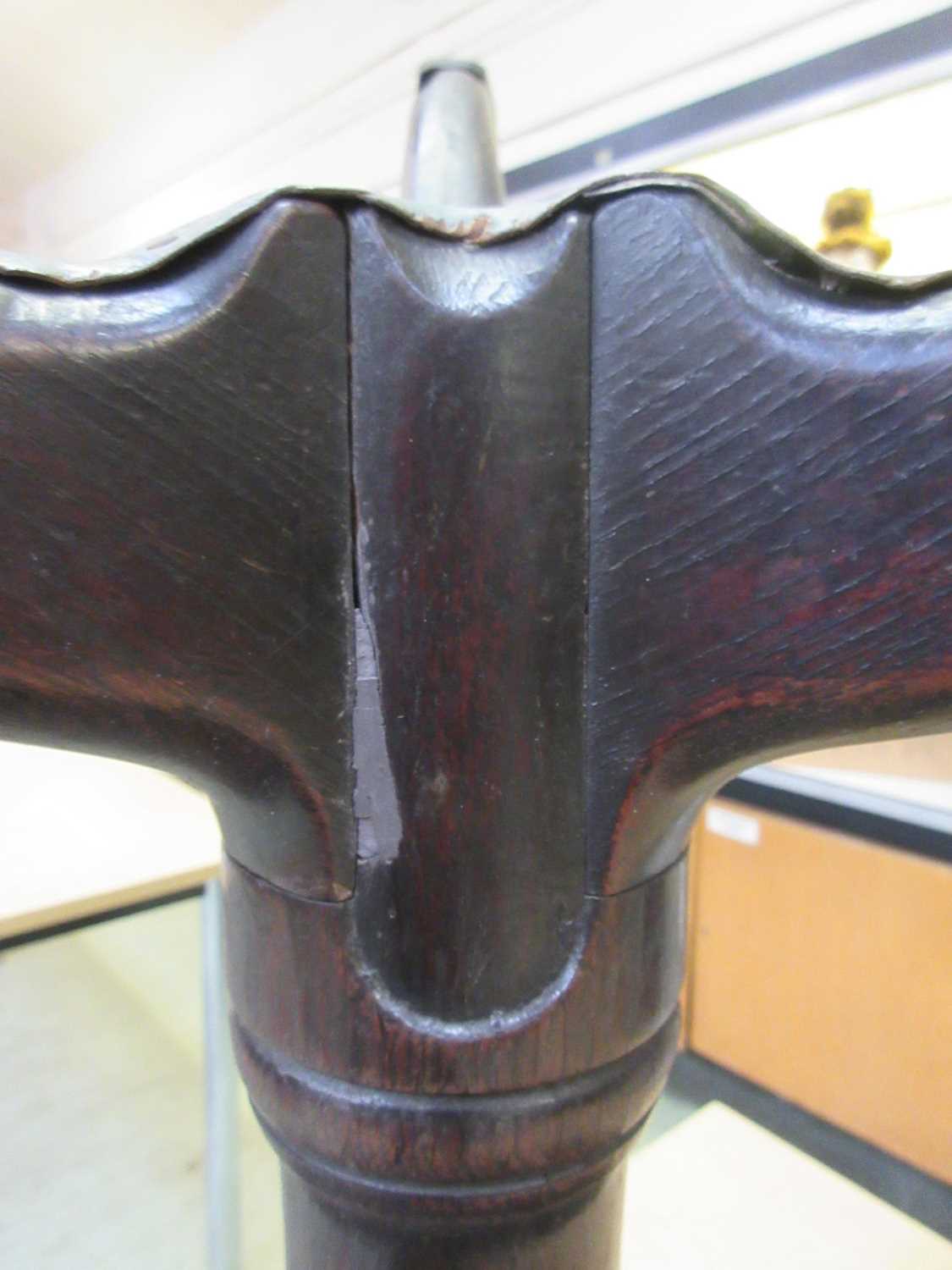 An 18th century oak tilt top tripod table, the circular top on a turned column on three splay - Image 11 of 11