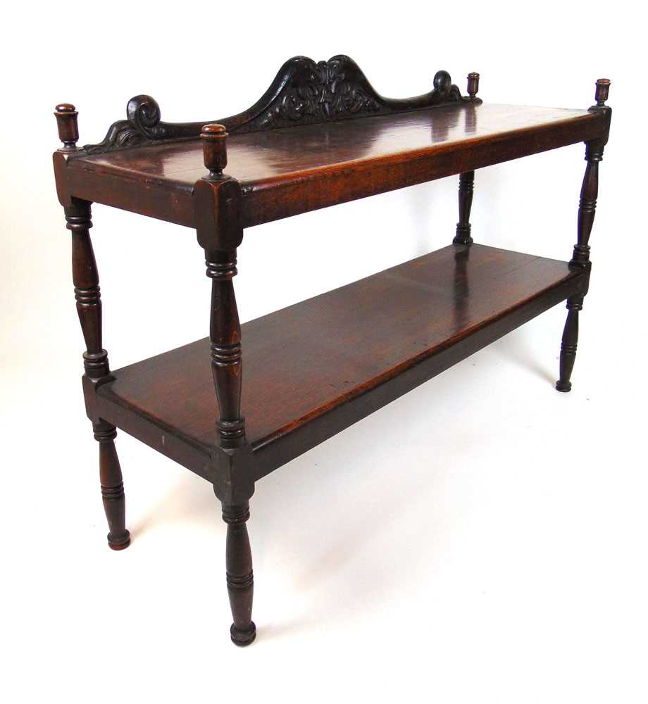 A 19th century oak two tier buffet, the mythical creature carved back above the two shelves - Image 2 of 2