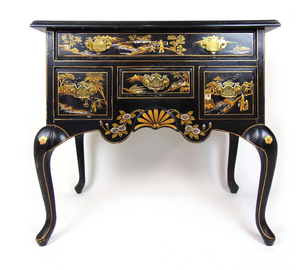 A 20th century Chinese black lacquer low boy, the top with figures in landscape scene over one