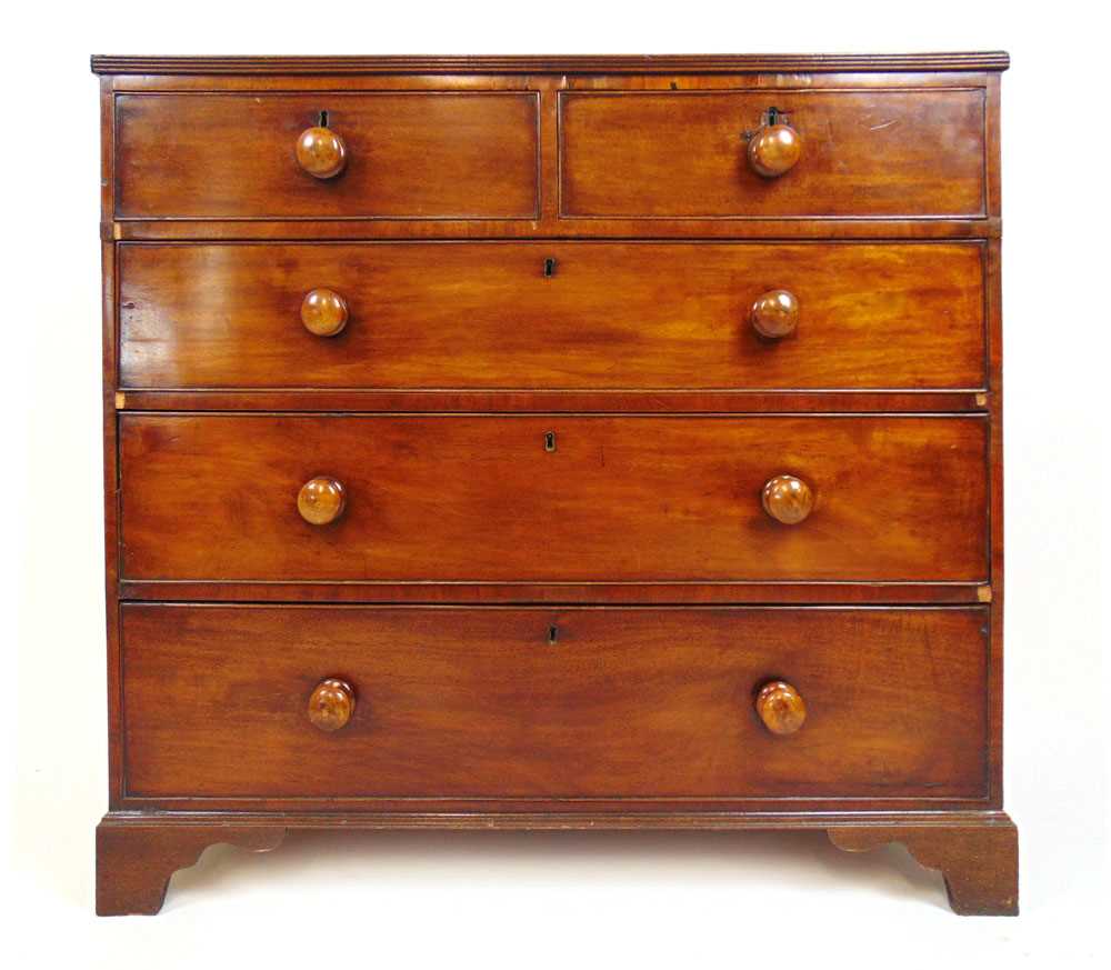 An early 19th century mahogany chest of two short over three graduating drawers on bracket feet, - Image 2 of 2