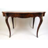A 19th century French walnut, kingwood banded and brass mounted free standing writing table, the