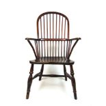 A 19th century ash,elm and beech Windsor chair, the comb back over turned legs and stretchers, h.