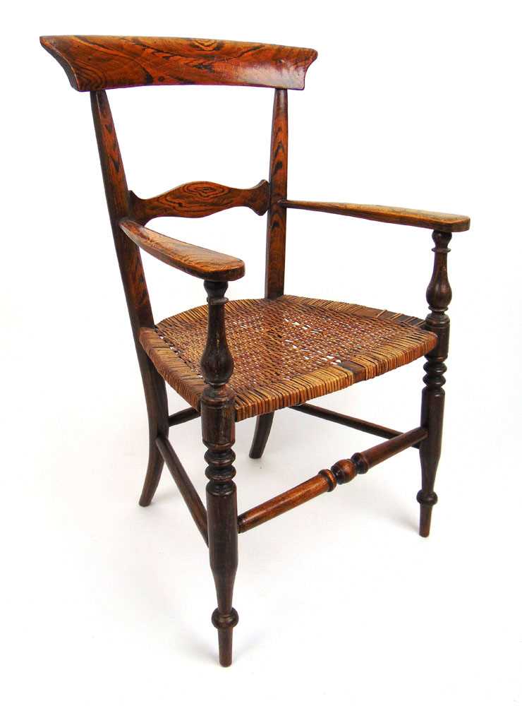 An early 19th century simulated rosewood childs armchair, the caned seat on turned legs and - Image 2 of 2