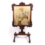 A Victorian rosewood fire screen with needlework panel depicting pious lady before a cathedral,