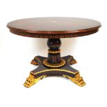 An early 19th century style parcel gilt and specimen wood center table, the Ceylonese inspired top