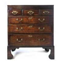 A Scottish George III mahogany and burr wood chest of drawers, the plain top with lip moulding above