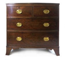 A 19th century mahogany bow fronted chest of drawers, the crossbanded top with ebony stringing and