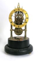 A Victorian brass skeleton clock timepiece, the single train fusee movement between gothic spire