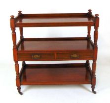 A late Victorian mahogany three tier buffet, the top with three quarter blind gallery and turned