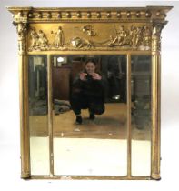 A 19th century gilt frame over mantel mirror, with inverted breakfront pediment above a series of