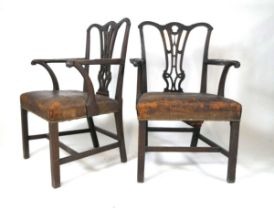 A pair of late 18th/early 19th century mahogany Chippendale style carver armchairs, with stuff