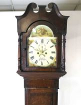 An early 19th century oak and mahogany crossbanded longcase clock, the hood with swan's neck