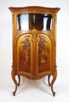 A 19th century French walnut, parcel gilt and painted cabinet, the serpentine top over single door