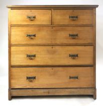 A Victorian pine Aesthetic period chest of drawers, the plain top with moulded edge above two