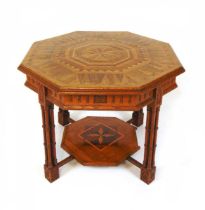 An Edwardian oak and inlaid wood occasional table, of octagonal form, the centre inlaide with a star