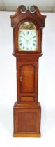 A Geo III oak and mahogany crossbanded longcase clock, with thirty hour movement chiming on a