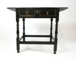 A provincial Queen Anne oak side table, c1700, the two plank top with moulded ends above a single