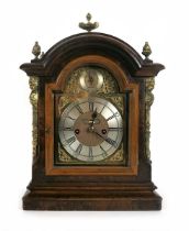 A George III and later walnut cased bracket clock, the arch brass dial with silvered chapter ring