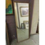 A gilt framed rectangular mirror