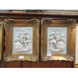 A pair of ornate gilt framed ceramic plaques depicting courting musical couples