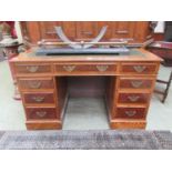 An early 20th century ash and thule twin pedestal desk