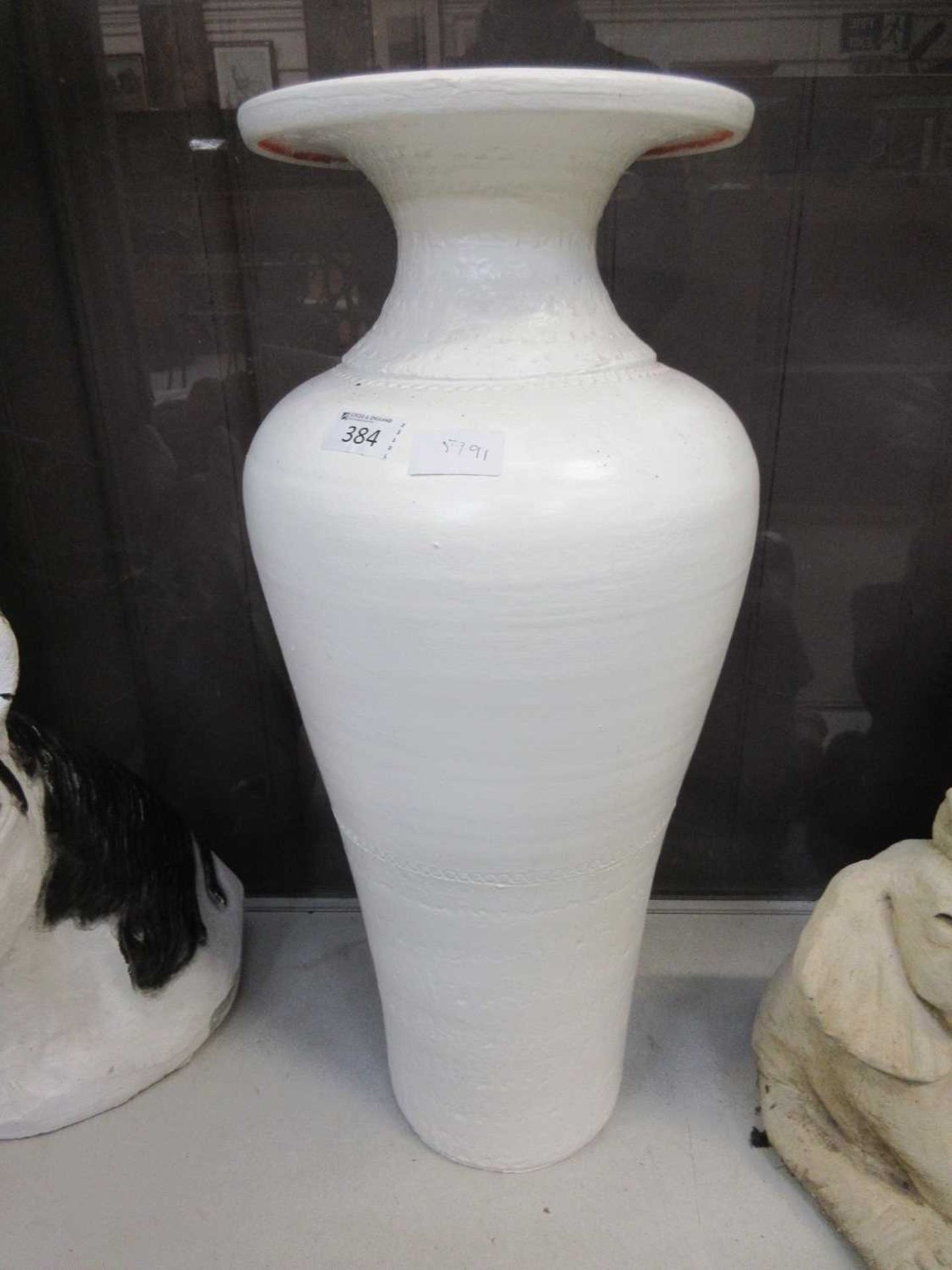 A white painted vase
