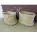 A pair of cement garden planters