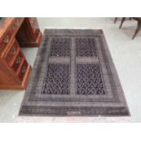 A Turkish rectangular grey and black rug