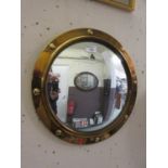 A brass framed convex mirror