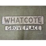Two road signs for 'Grove Place' and 'Whatcote'