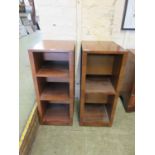 A pair of walnut open bookcases