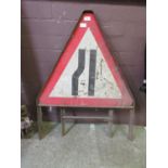 A free standing road sign 'Narrow Lanes'