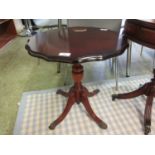 A reproduction mahogany occasional table