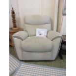 An electric rise and recline armchair upholstered in a beige fabric