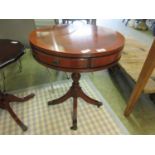 A reproduction mahogany and banded occasional drum table