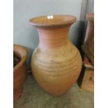 A large terracotta urn