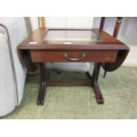 A reproduction mahogany low level display table