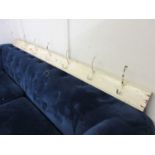 A 19th century cream painted coat rack