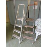 Two sets of step ladders