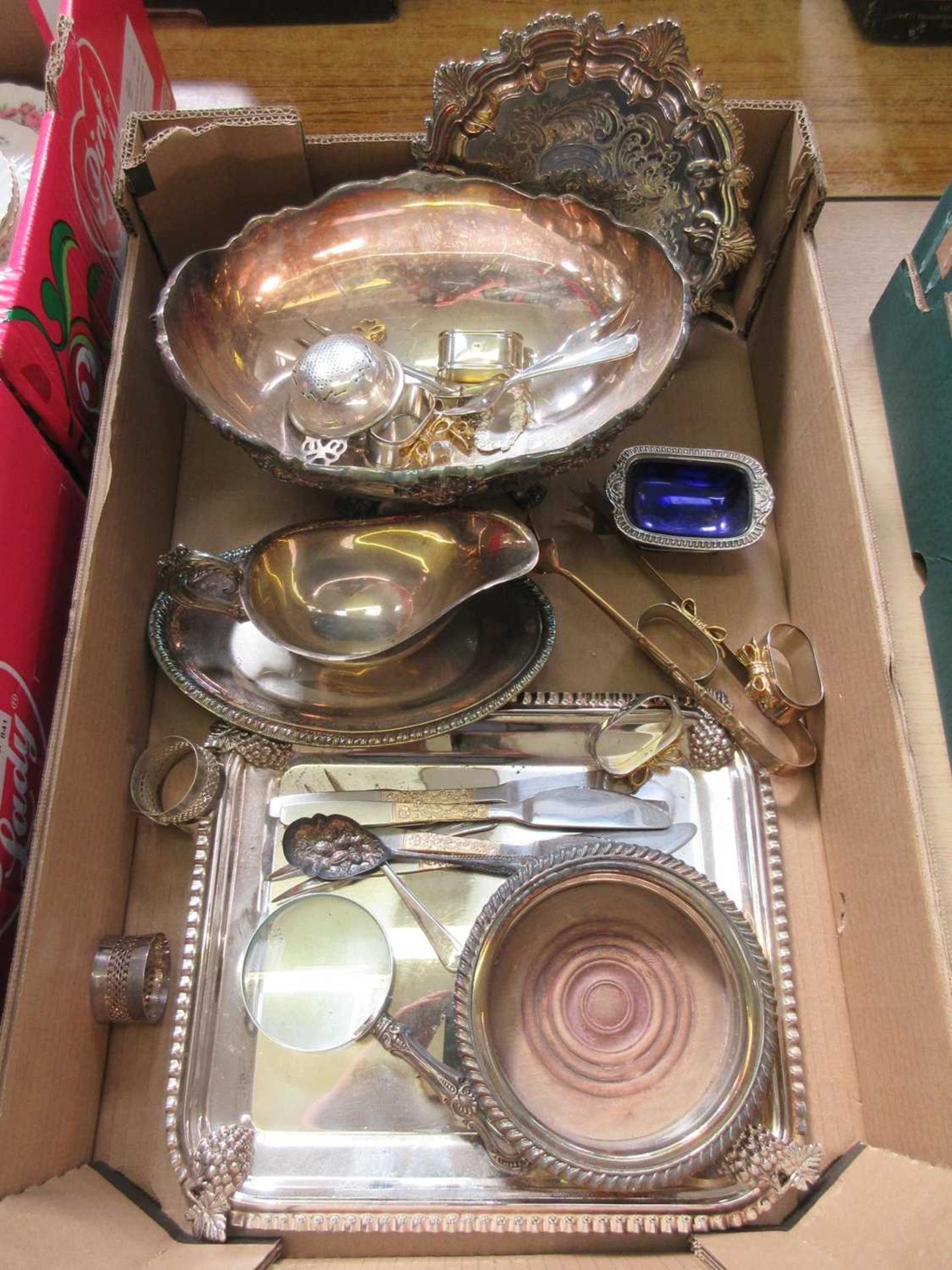 A tray of various plated ware to include napkin rings, sauce boats, bowls, etc