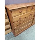 A modern pine chest of two short over four long drawers