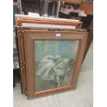 An assortment of framed and glazed prints on various subjects