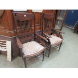 A pair of early 20th century embossed spindle back open armchairs
