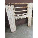 A white painted fire grate