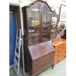 An early 20th century mahogany bureau bookcase having a pair of glass doors to top, the bae having